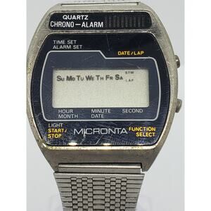 Micronta Digital watch. Multifunction face with gold accents